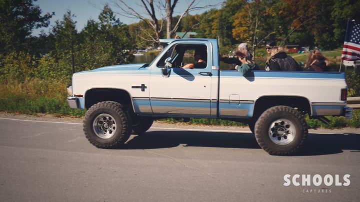 Light blue/white lifted with flag + people
